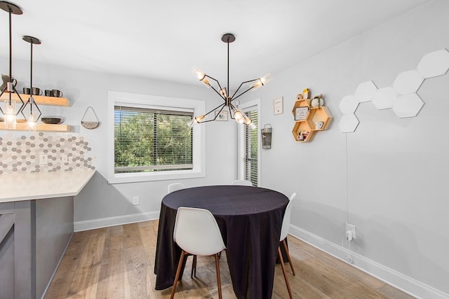 dining room featuring a chandelier and wood-type flooring