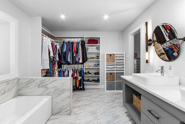 bathroom with vanity and a bathing tub