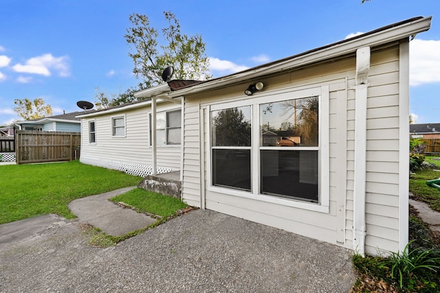 rear view of house with a lawn