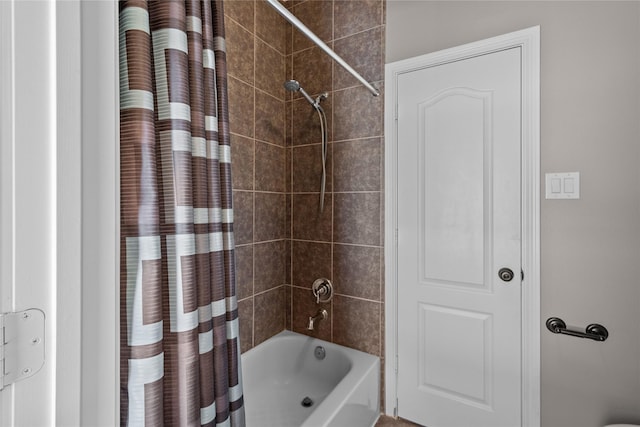 bathroom featuring shower / bathtub combination with curtain