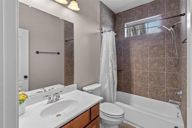 full bathroom featuring vanity, toilet, and shower / tub combo