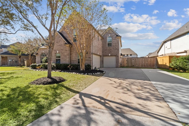 view of front of house featuring a front yard and a garage