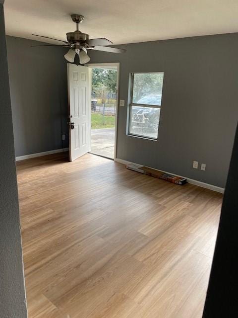 spare room with ceiling fan and light hardwood / wood-style floors