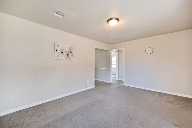 unfurnished room featuring carpet floors