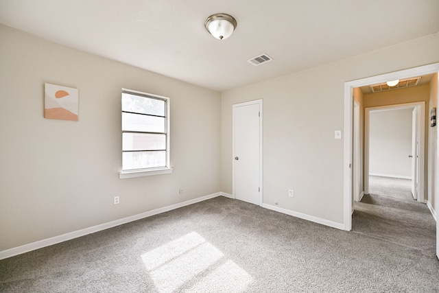 empty room featuring carpet flooring