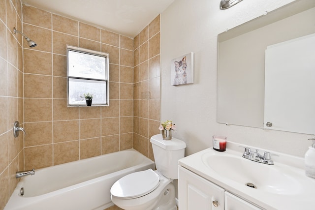 full bathroom featuring toilet, vanity, and tiled shower / bath combo