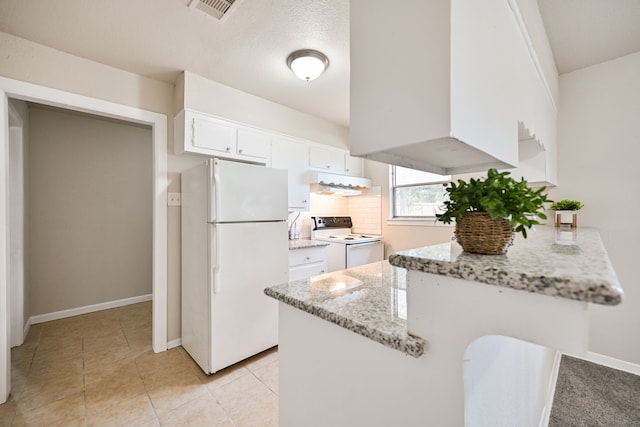 kitchen featuring white appliances, backsplash, white cabinets, light stone countertops, and kitchen peninsula