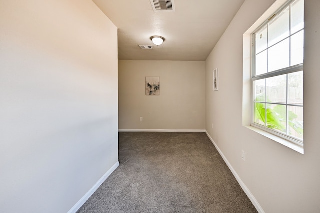 unfurnished room with carpet floors