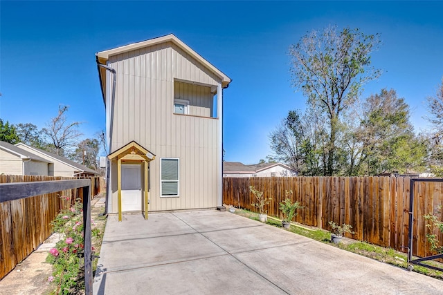 rear view of property featuring a patio area