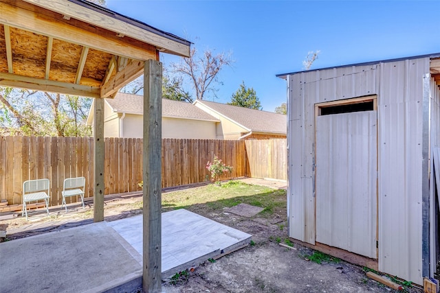 view of patio featuring a shed