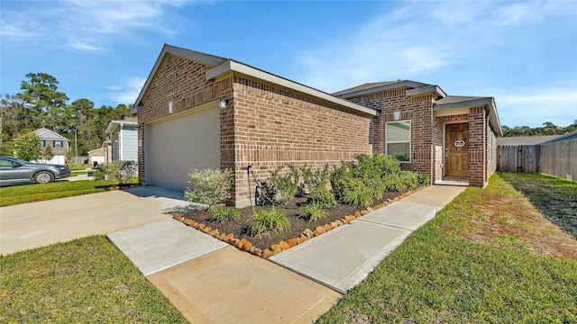 view of front of house with a front yard and a garage