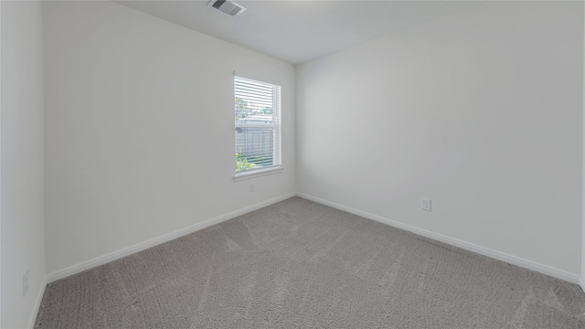 spare room with carpet floors