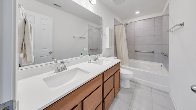 full bathroom with tile patterned flooring, vanity, shower / tub combo, and toilet