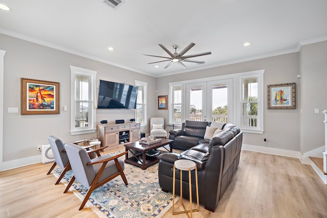 living room with french doors, light hardwood / wood-style flooring, ceiling fan, and ornamental molding