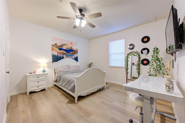 bedroom featuring light hardwood / wood-style flooring and ceiling fan