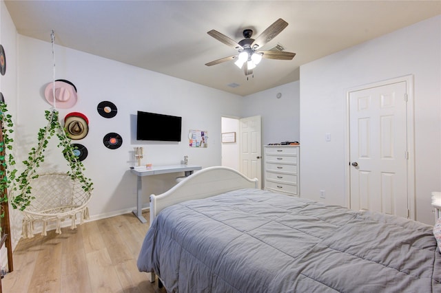 bedroom featuring ceiling fan and light hardwood / wood-style floors