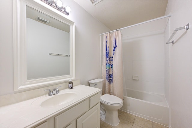 full bathroom featuring vanity, tile patterned floors, toilet, a textured ceiling, and shower / tub combo