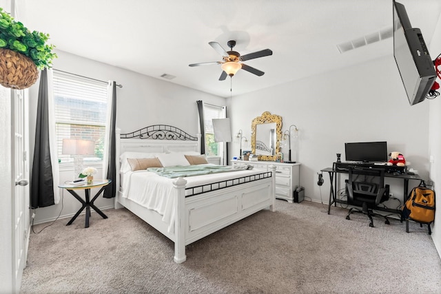 carpeted bedroom featuring ceiling fan