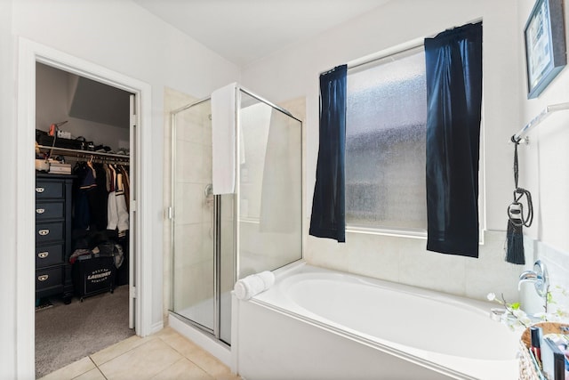 bathroom with tile patterned flooring and plus walk in shower