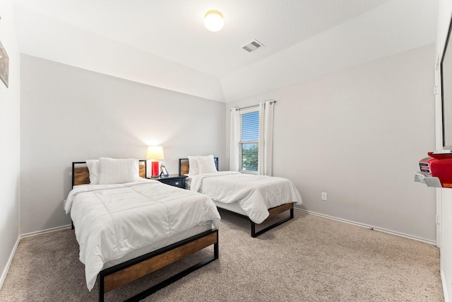 carpeted bedroom featuring vaulted ceiling