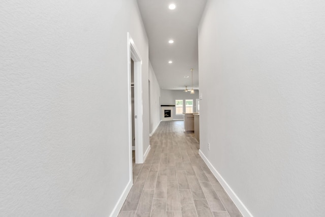 hall with light hardwood / wood-style flooring