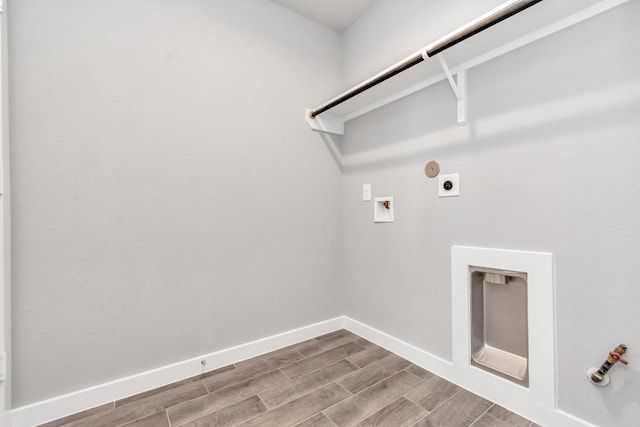 laundry area with hookup for an electric dryer, washer hookup, light hardwood / wood-style floors, and hookup for a gas dryer