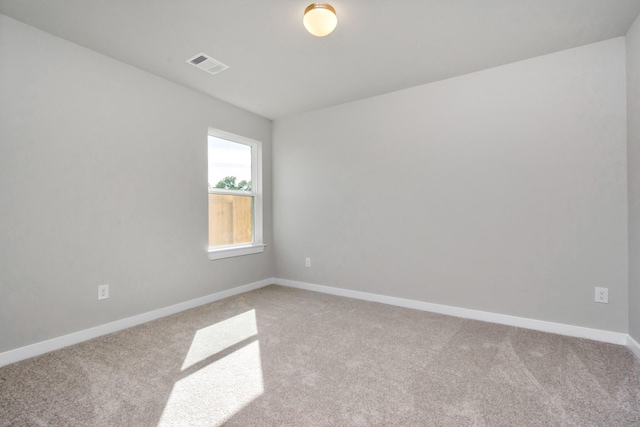 unfurnished room with light colored carpet