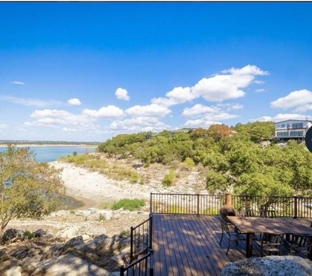 wooden deck featuring a water view