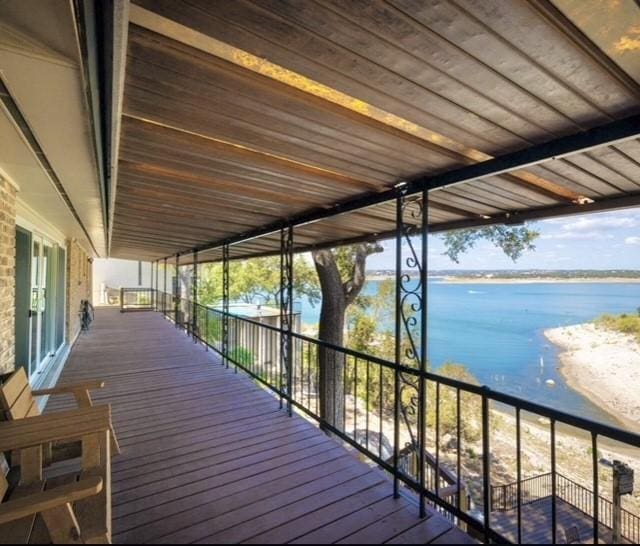 wooden terrace with a water view