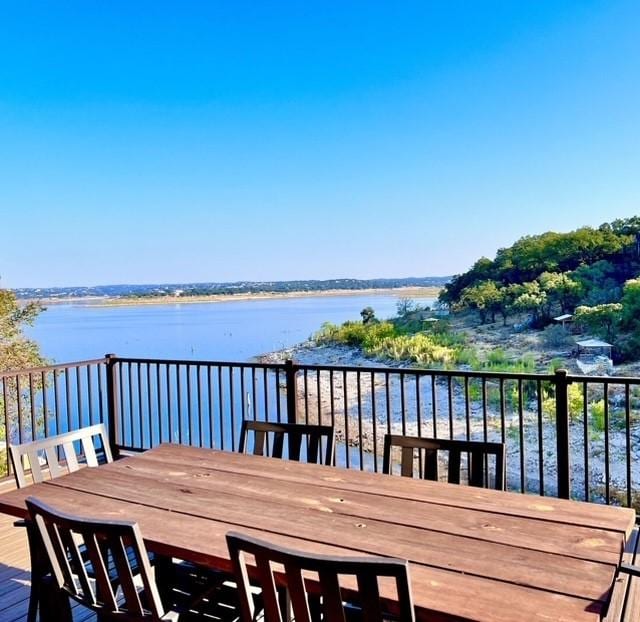 wooden deck featuring a water view