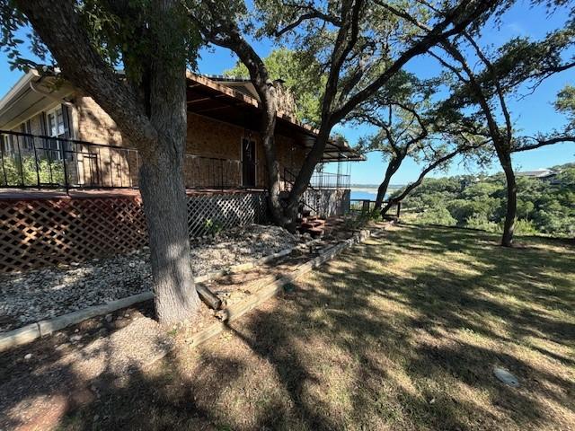 view of property exterior featuring a lawn