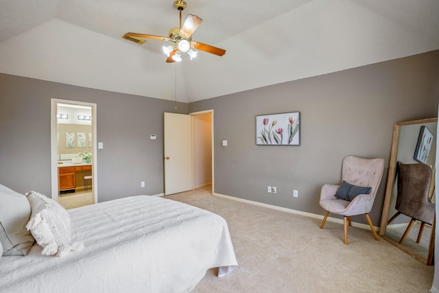 carpeted bedroom with ceiling fan, lofted ceiling, and connected bathroom