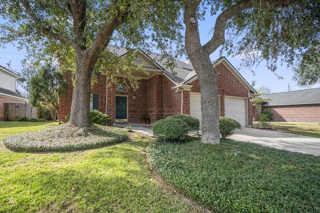 view of front of house featuring a garage and a front lawn