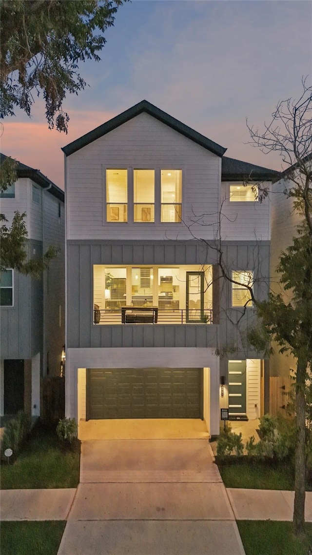 view of front of house featuring a balcony and a garage