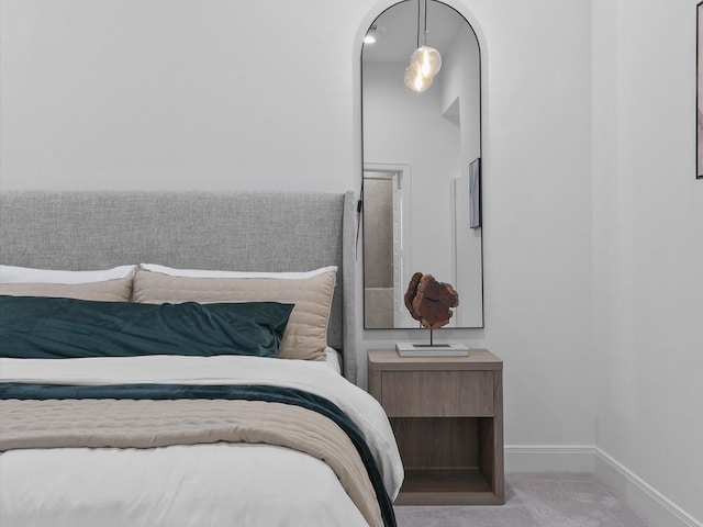 bedroom featuring light colored carpet