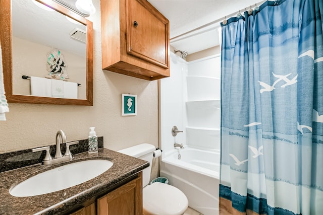 full bathroom with shower / bath combination with curtain, toilet, and vanity