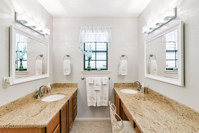 bathroom featuring vanity and a textured ceiling