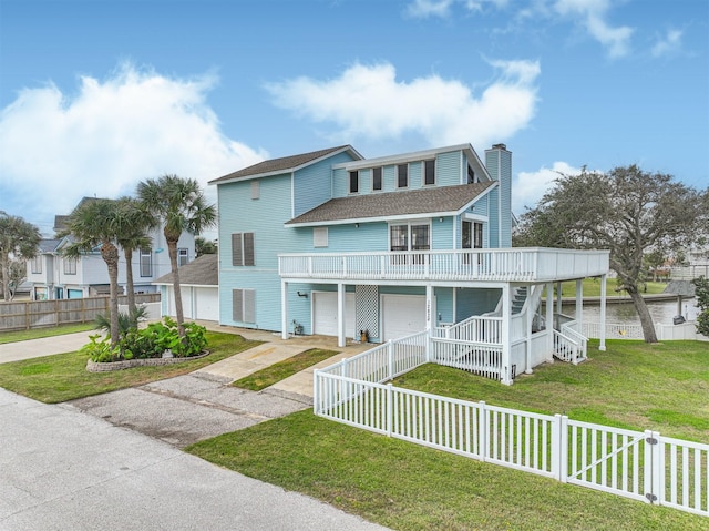 view of front facade with covered porch and a front yard