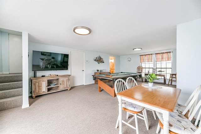 carpeted dining area featuring pool table