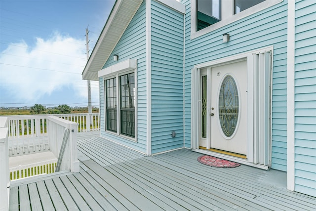 property entrance with a wooden deck