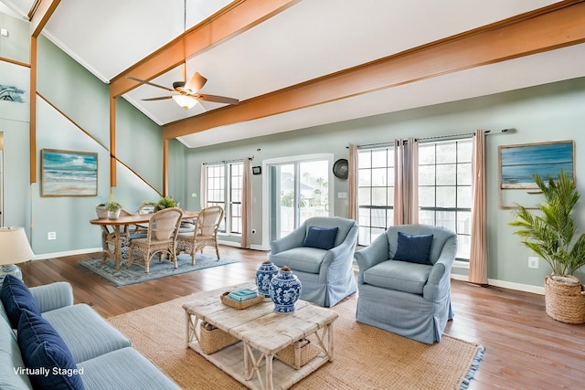 living room featuring ceiling fan, beamed ceiling, high vaulted ceiling, and light hardwood / wood-style floors