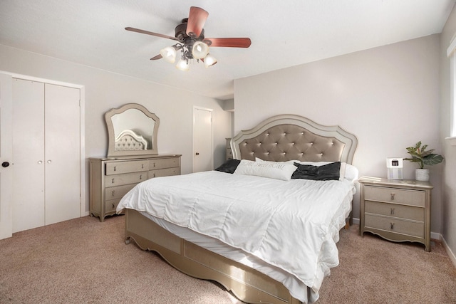 carpeted bedroom with ceiling fan