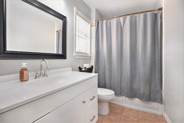 full bathroom with tile patterned floors, vanity, toilet, and shower / tub combo with curtain