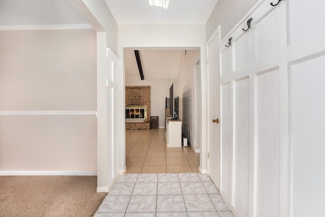 hall with light tile patterned floors