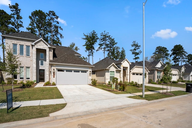 view of front of property with a garage and a front yard