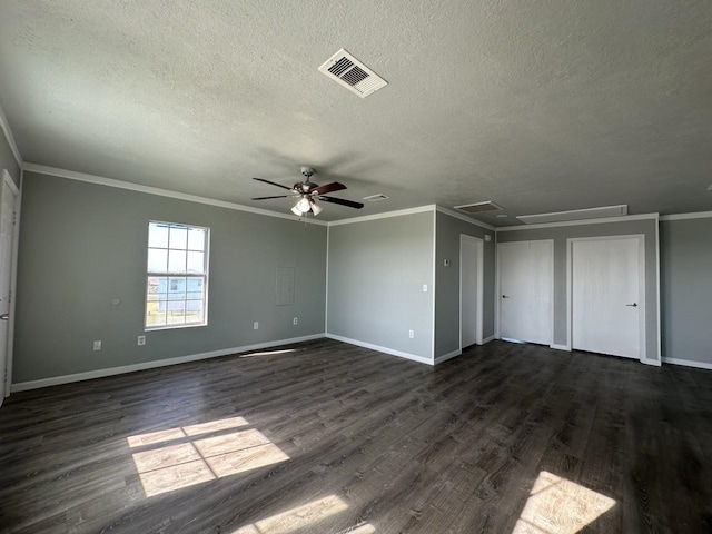 interior space with ceiling fan, dark hardwood / wood-style flooring, a textured ceiling, and crown molding