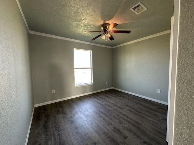 empty room featuring ornamental molding, a textured ceiling, ceiling fan, and dark wood-type flooring