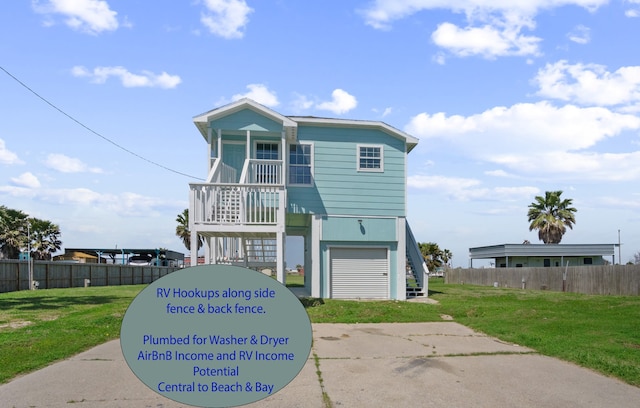 raised beach house featuring stairs, a front lawn, and fence