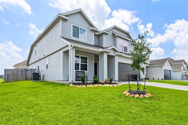 view of front of house featuring a front lawn, a garage, and cooling unit