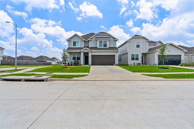 view of front facade with a garage and a front yard